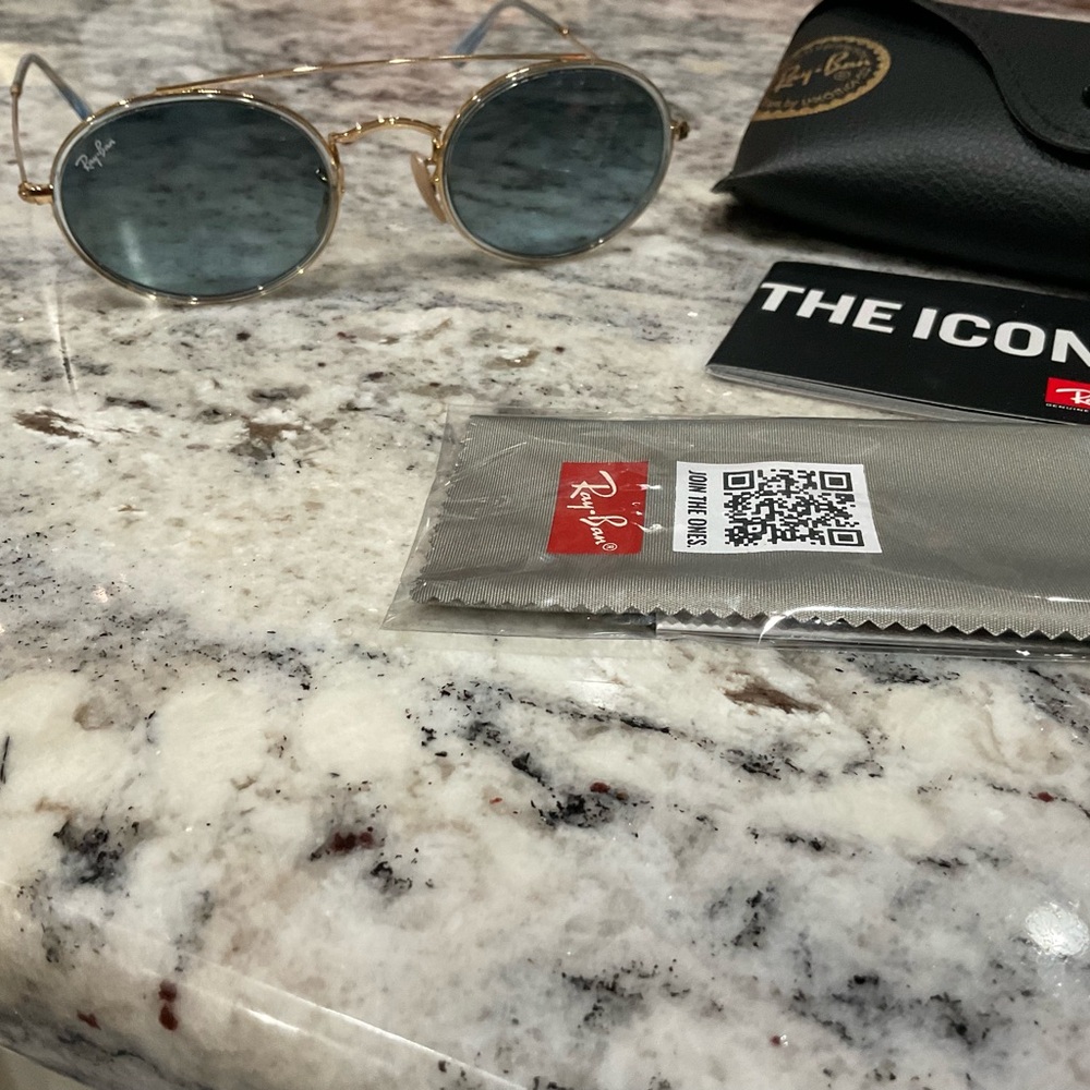 Ray-Ban Gold and Blue Oval Double Bridge Sunglasses
Oval metal-frame sunglasses